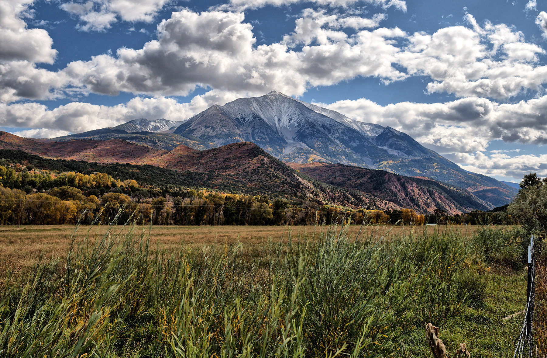 Mt. Sopris viewed from Colorado Highway 133 north of Carbondale, Co.  This was formed by an intrusion of igneous rock (quartz monzonite) during the Tertiary period (25-50 Ma) with subsequent erosion of overlying sedimentary rock and modified by glacial action.