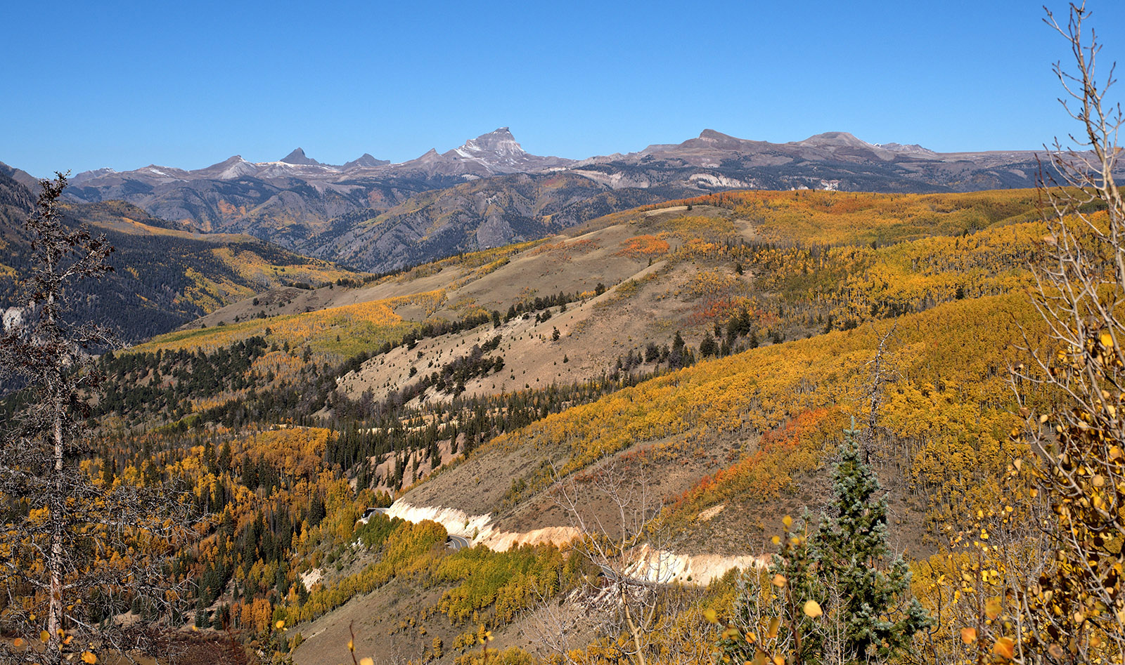 Looking West from Windy Point overlook towards the San Juan Mountains.  The tallest peak is Uncompahgre Peak.  Most of the peaks are from middle-phase Tertiary lava flows.