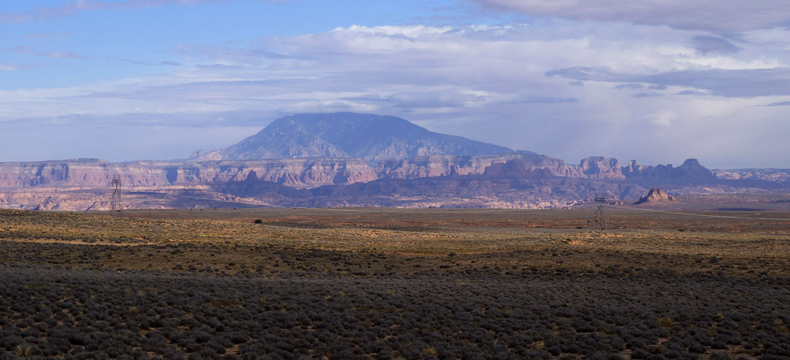 Scenery along Arizona Highway 98, looking Northeast to Navajo Mountain (10,300 ft) which is formed by an intrusive mound of igneous rock (laccolith) into covering and surrounding sedimentary layers.