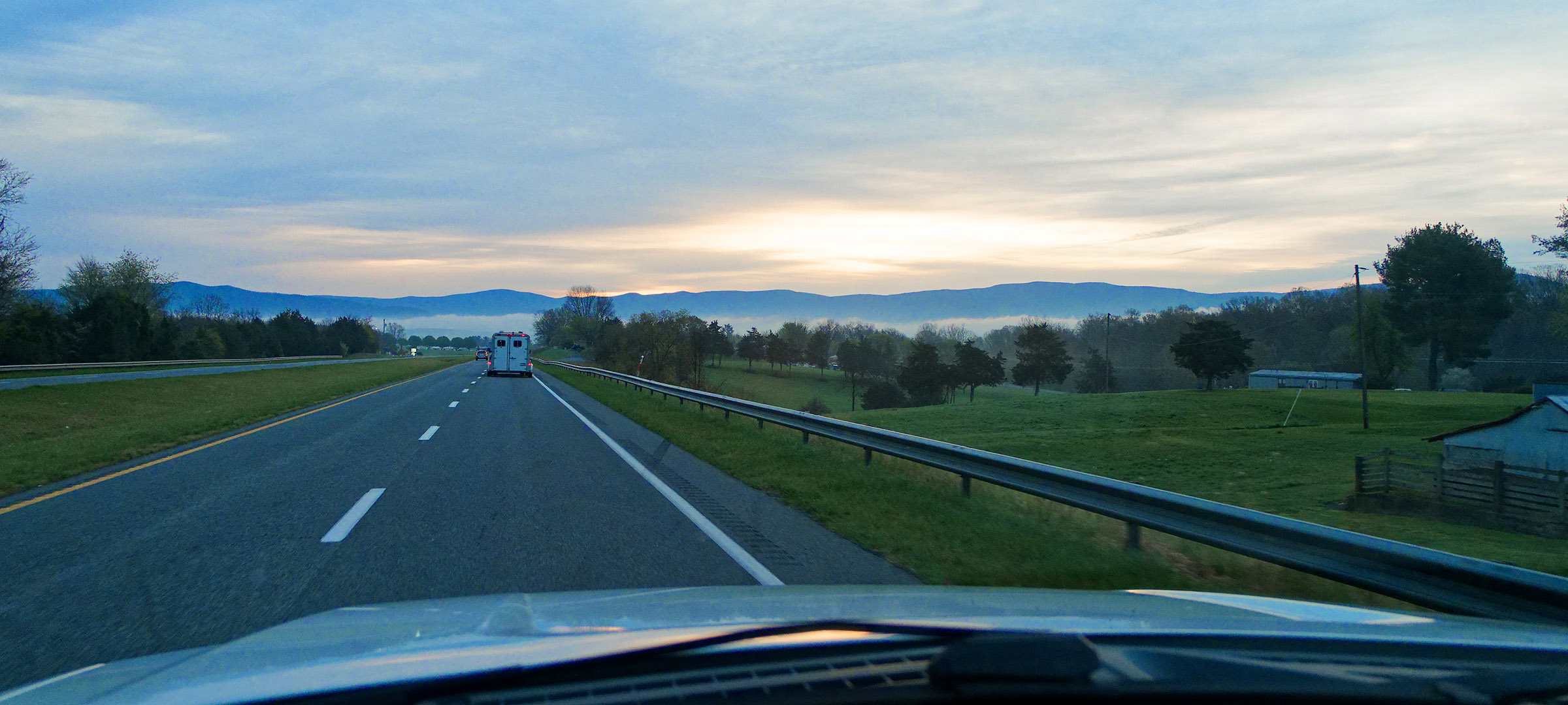 The Blue Ridge Mountains at sunrise as viewed from Highway 33.  Fog is present over the South branch of the Shenandoah River.