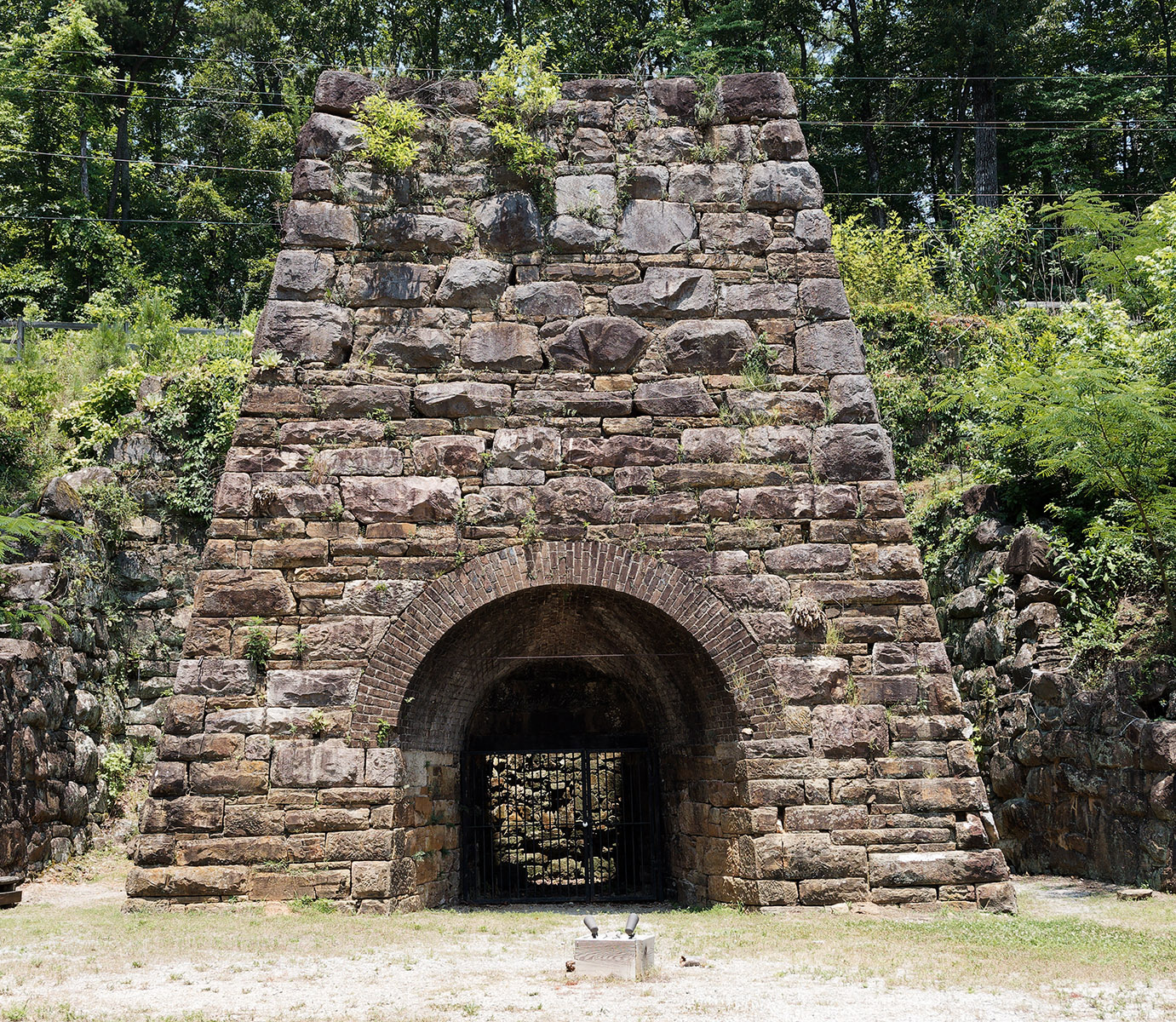 Janney Furnace in Ohatchee AL.  This is the remnant of furnace works built to produce pig iron during the Civil War.  The Confederacy was desperately short of pig iron and steel for military purposes, and the location was chosen due to the abundance of iron-containing ore (hematite), limestone and coal in the area.  On July 14, 1864, a Union cavalry raiding force attacked the furnace works having learned of the works during a general movement to destroy railroads between Montgomery AL and West Point GA.  The buildings and chimney of the furnace were destroyed after a much smaller Confederate cavalry force engaged Union cavalry at the Battle of “Ten Islands” on the Coosa River ¼ mile above the current site of the Neely Henry Dam.