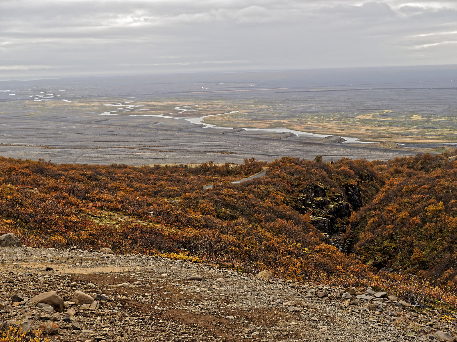 Skeiðarársandur alluvial plain and Skeiðará river in the distance out to the coast viewed from the trail to Svartifoss.