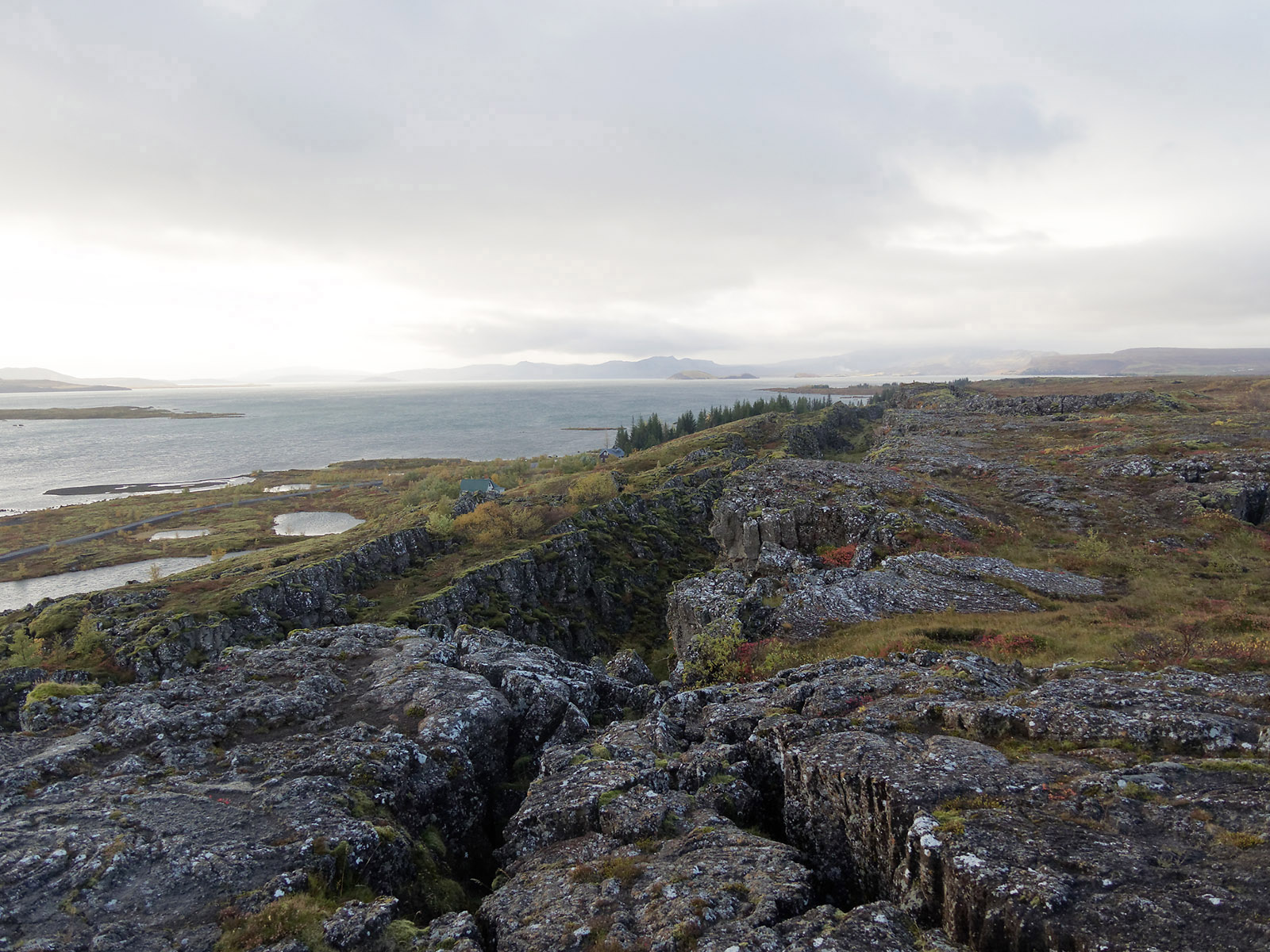 Þingvellir National Park Overlook at Almannagja (day 2): The view over Lake Þingvallavatn with interconnected faults in the lava fields on the bordering North American plate. Lava fields at Þingvellir have been radio-dated to be about 10,000 years old.