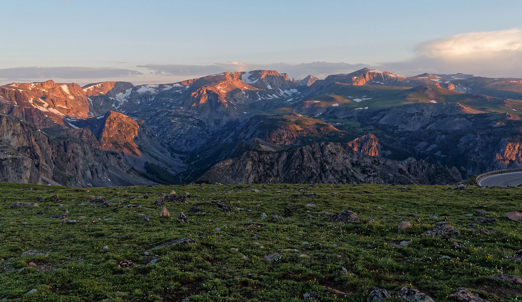 Beartooth Plateau at dawn.  This plateau and associated Beartooth Pass at 10,947 ft (3,337 m) was forced upward during the Laramide orogeny (150 million years ago - 150 MA) initiated by tectonic plate subduction  as what is now the western continent of North America was growing.  Overlying layers were eroded by water, wind and, most notably, by glacier activity (1.5 MA) down to Precambrian rock.  This plateau continues to rise as it is eroded due to the Yellowstone hot spot.