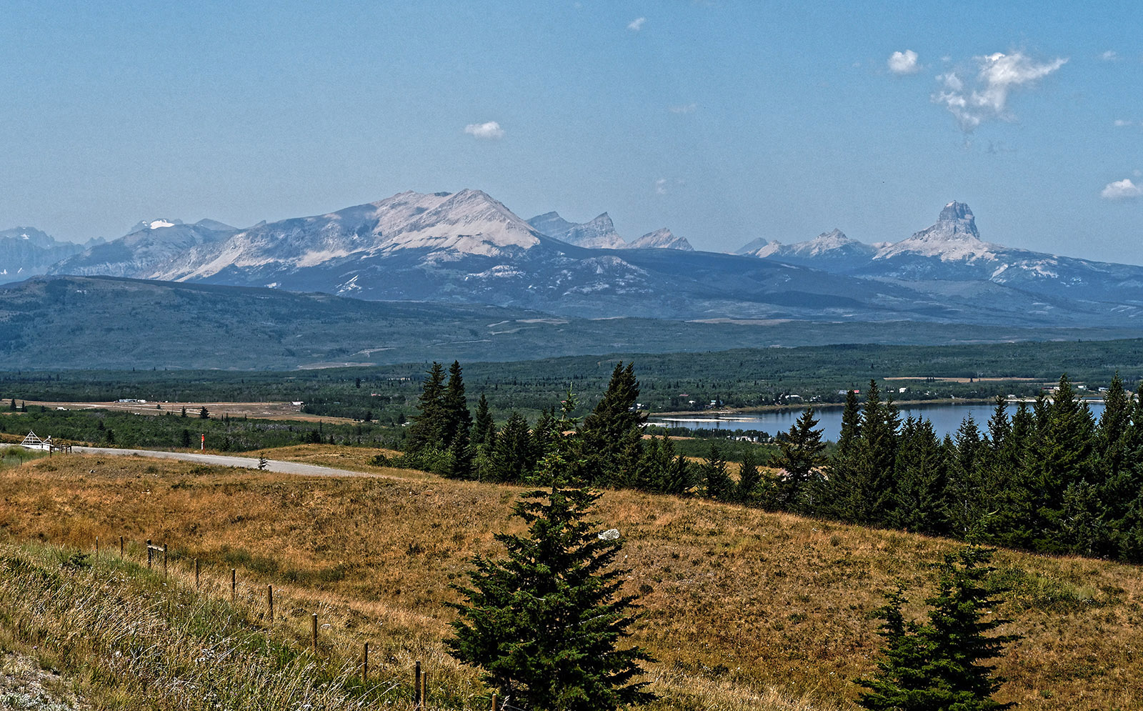 The view from East of Glacier National Park overlooking Babb, MT towards Chief Mountain at the far right.  The Lewis Overthrust fault continues from the left.  Erosion has isolated Chief Mountain from the rest of the strata in the overthrust section.