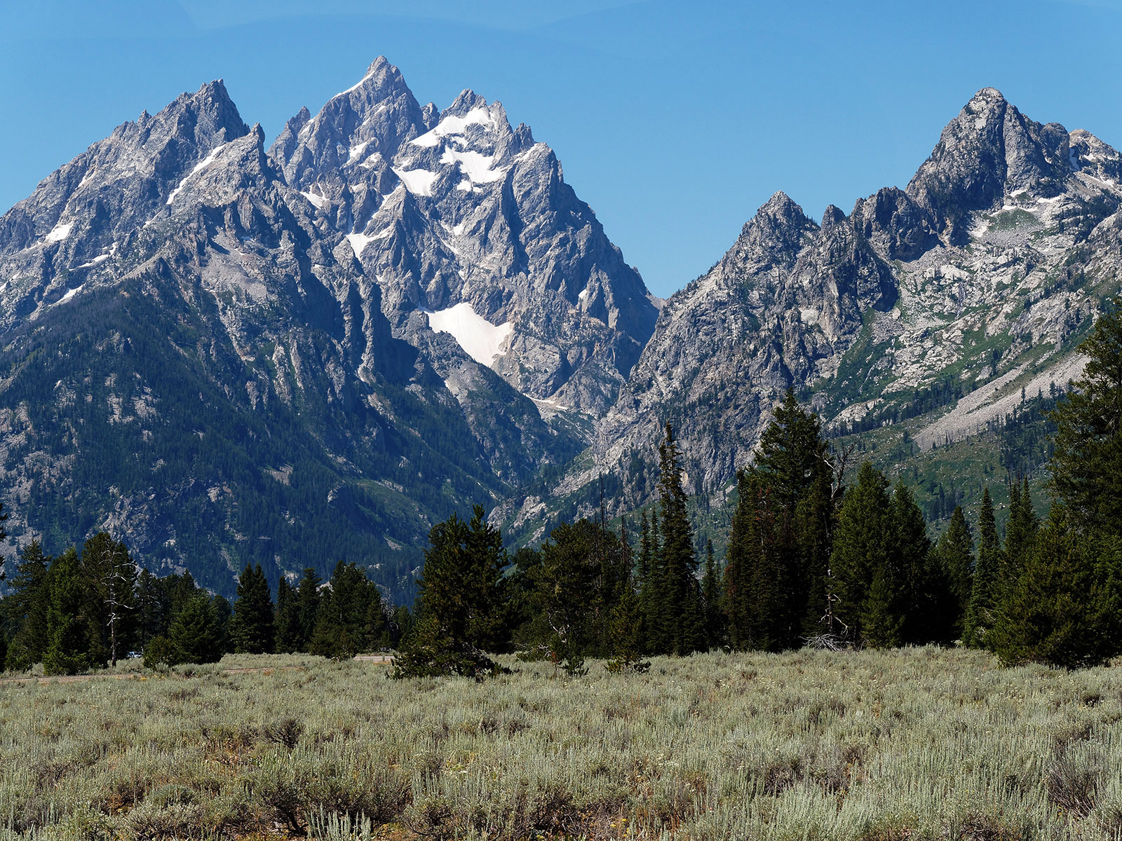 From left to right:  Teewinot, Grand Teton, Cascade Valley and Mt. St. John.