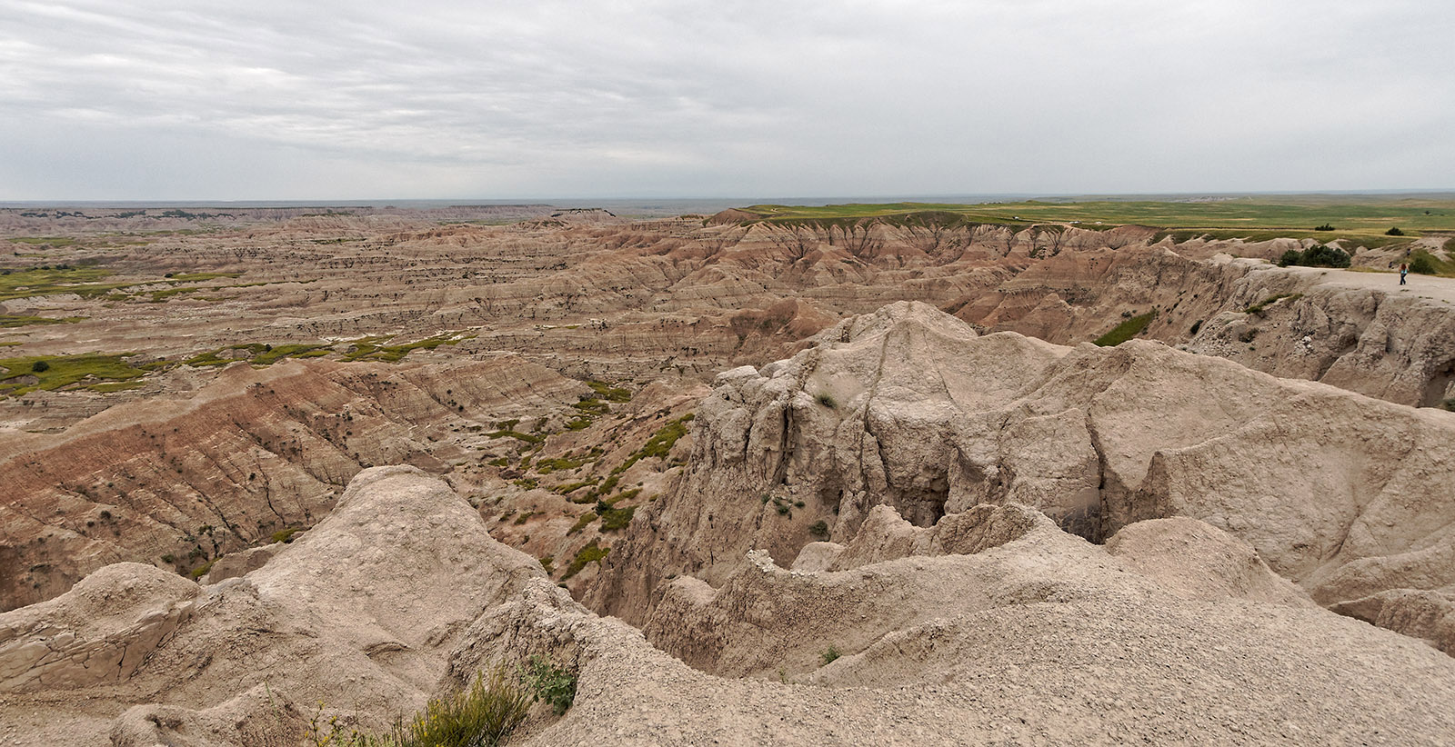 Badlands National Park, South Dakota.  Pinnacles overlook:  Most of the erosion has occurred in white volcanic ash that was deposited starting 27 million years ago.  Serious erosion began approximately 500,000 year ago when the High Plains became more elevated enhancing river flow.