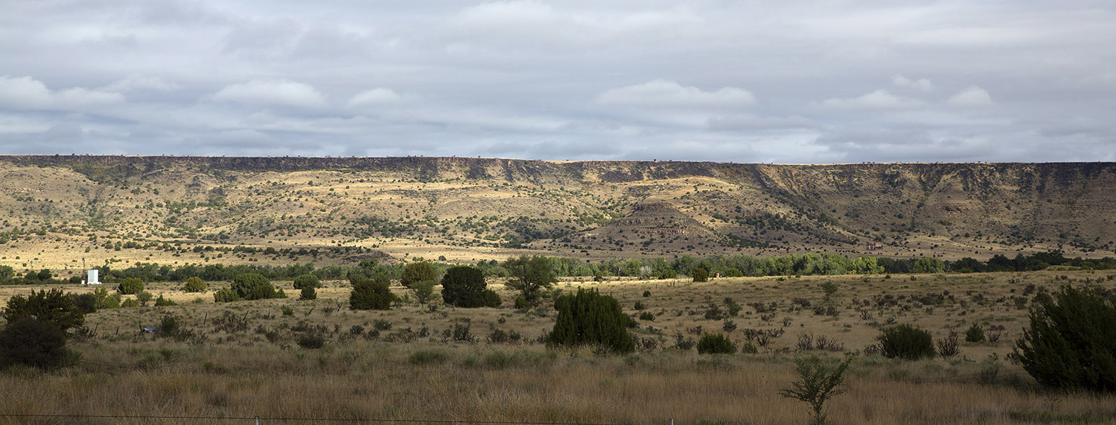 Black Mesa near Kenton, OK where Okie Tex Star Party was held.  Basalt from volcanic activity in the Neogene Period (23-2.5 million years ago) overlies sedimentary layers of sandstone from the Jurassic and Cretaceous Periods (200-66 million years ago).