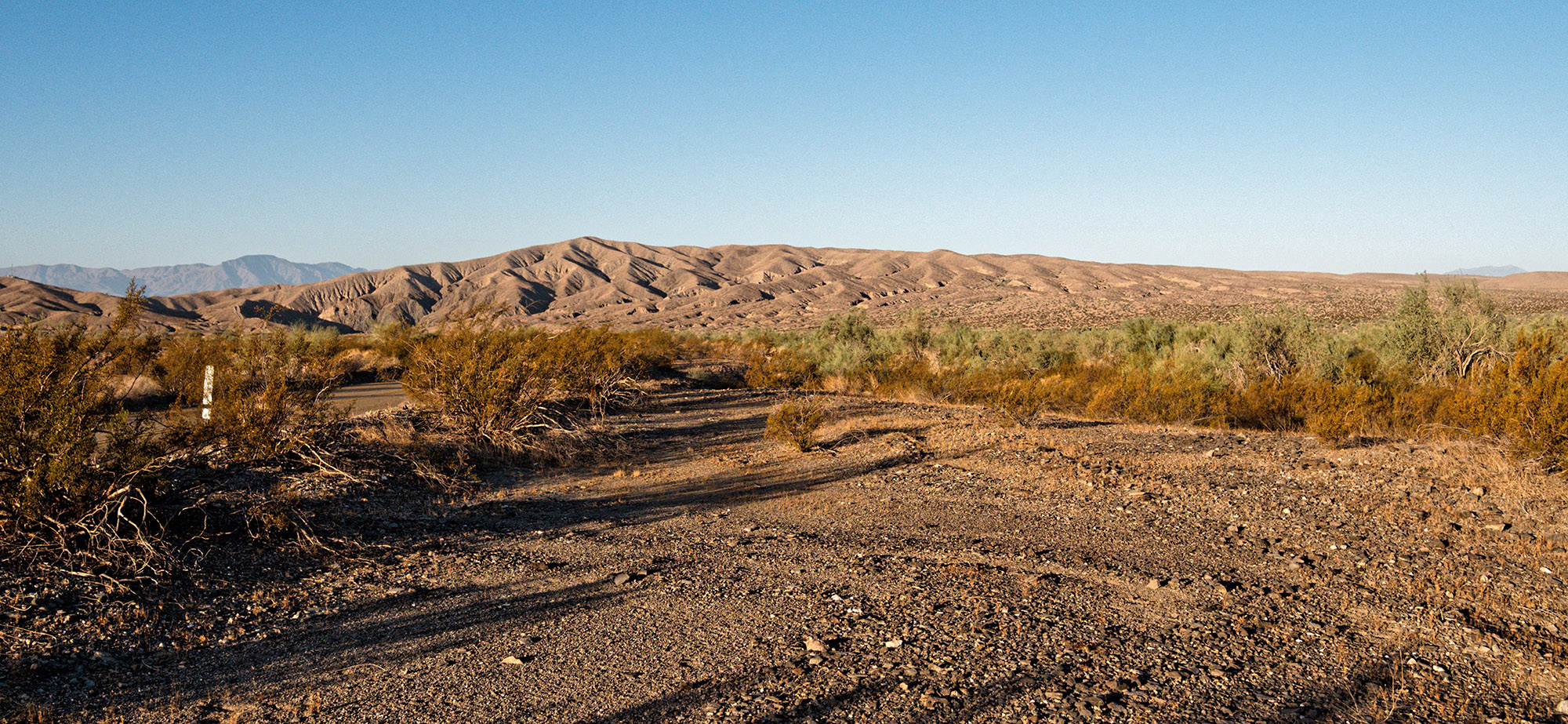 Mecca Hills viewed from the East off Box Canyon Road.  The Mecca Hills are composed of highly folded sedimentary layers from the Pliocene and Pleistocene (1 to 5 Ma).