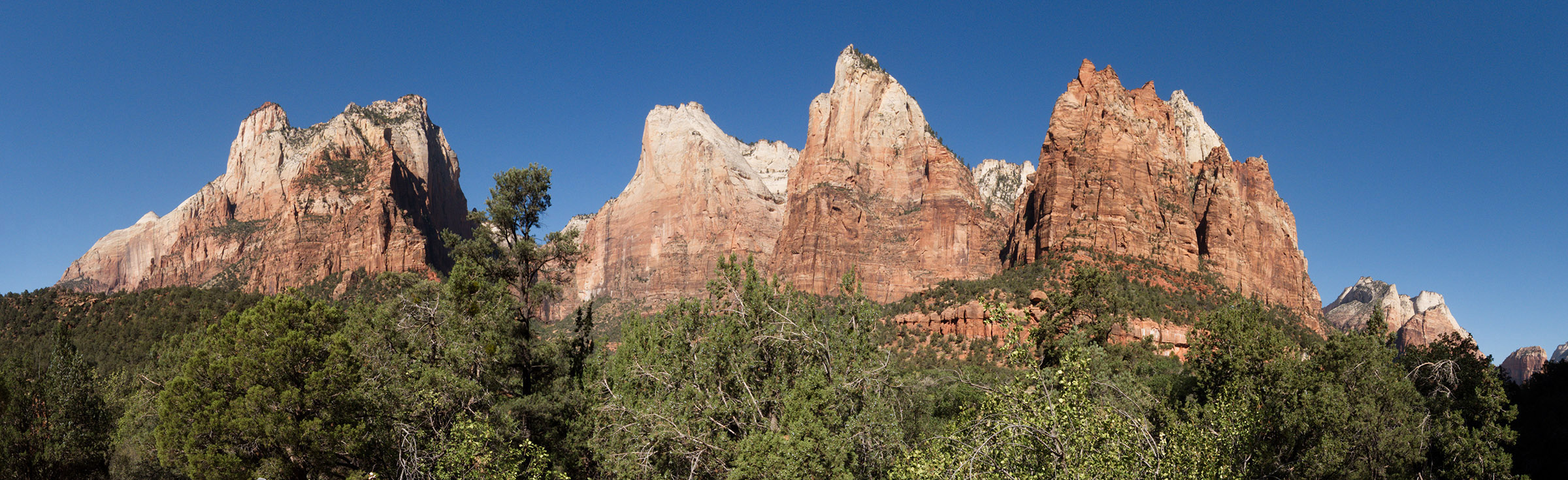 Navajo sandstone peaks as viewed from Zion Canyon.; Three peaks to the right are Abraham; Isaac and Jacob Peaks (Court of the Patriarchs).