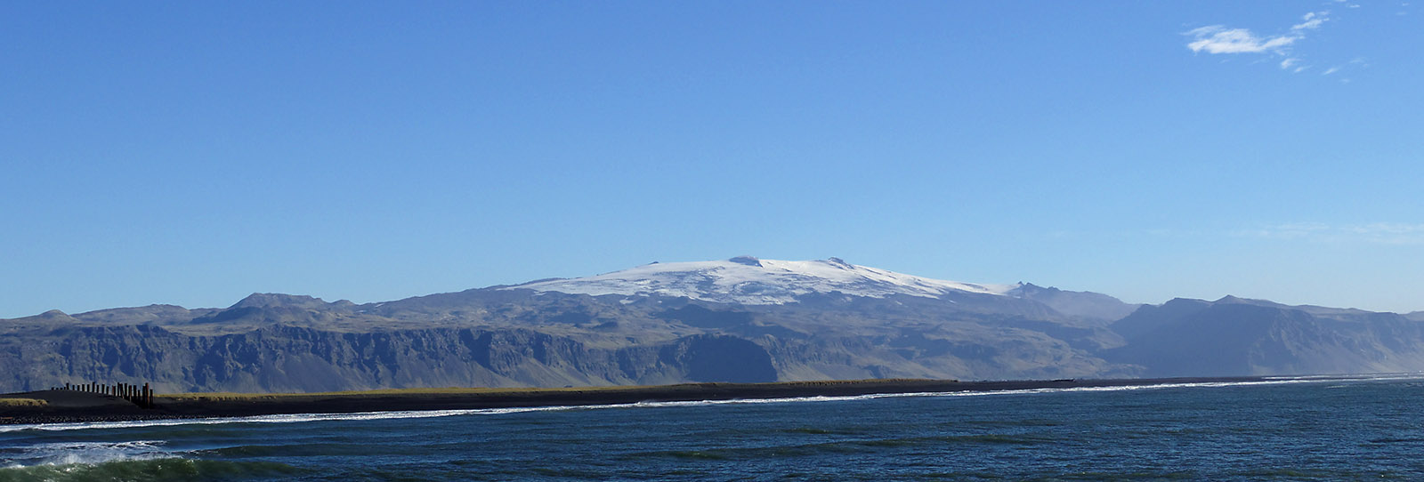 Eyjafjallajökull volcano viewed from the ferry boat to the Westman Islands.  This snow-covered volcano erupted in 2010 with heavy ash clouds causing disruption of air travel across Western Europe.